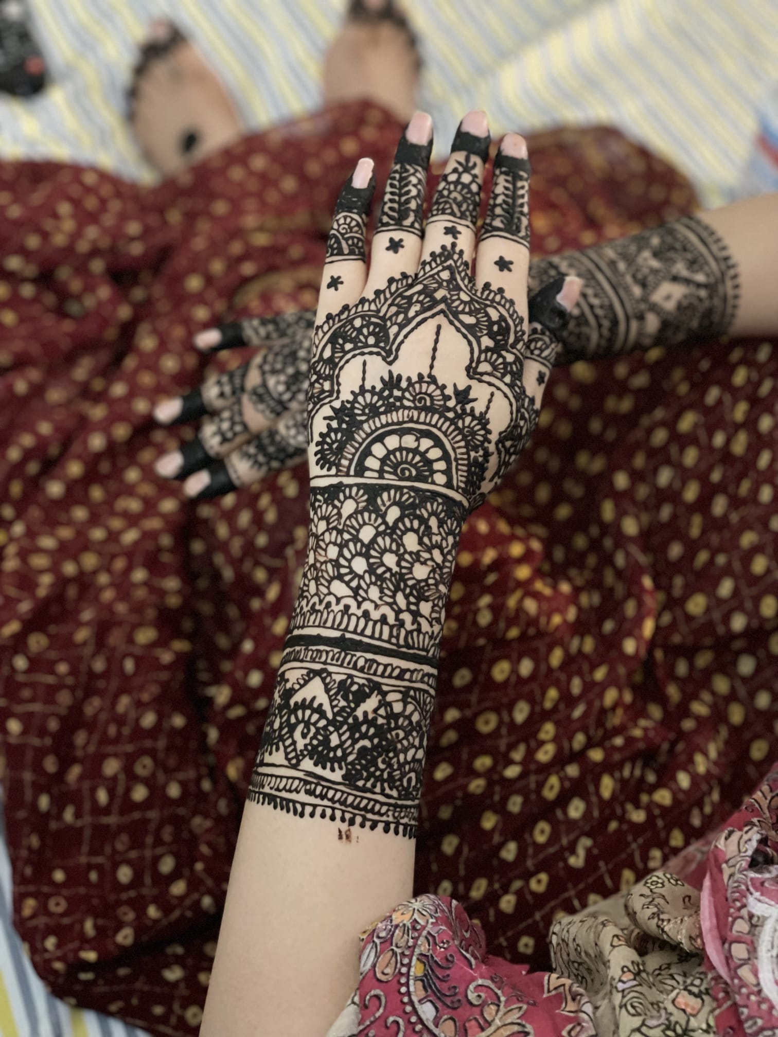 Full hand mehndi design with floral motifs